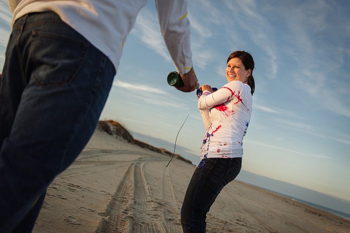 Erica and Mike's Paint Fight Engagement Session on the Beach in OBX