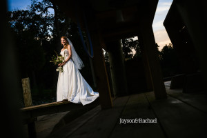 Bridal portraits on a dock by the river